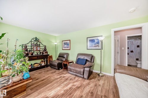 Sitting room featuring wood finished floors and baseboards - 3634 113 Avenue, Edmonton, AB - Indoor