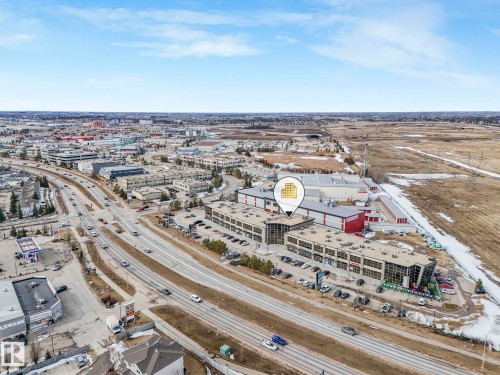 Aerial view showcasing the property's advantageous location near a major roadway, providing convenient transportation access - 123 230 Edwards Drive, Edmonton, AB - Outdoor With View
