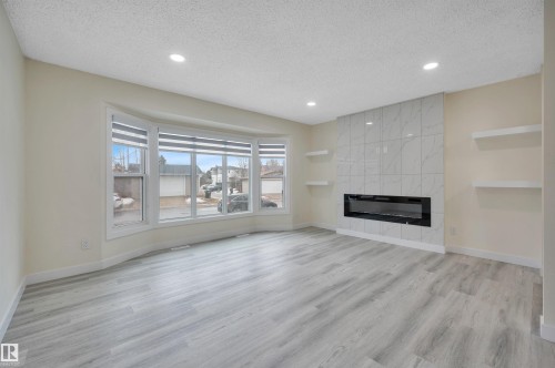 2010 46 Street, Edmonton, AB - Indoor Photo Showing Living Room With Fireplace