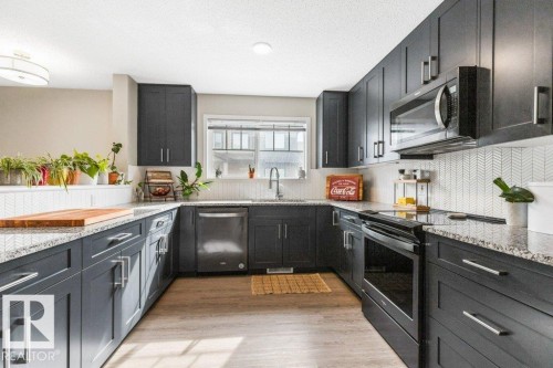 102 3305 Orchards Link Link, Edmonton, AB - Indoor Photo Showing Kitchen With Upgraded Kitchen