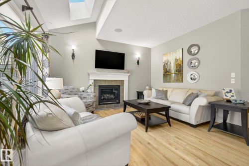1079 Mckinney Green, Edmonton, AB - Indoor Photo Showing Living Room With Fireplace
