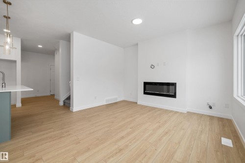 915 19 Avenue, Edmonton, AB - Indoor Photo Showing Other Room With Fireplace