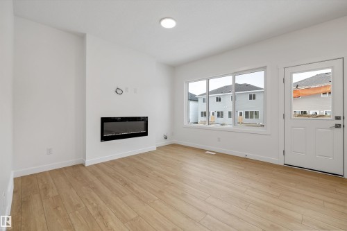 915 19 Avenue, Edmonton, AB - Indoor Photo Showing Living Room With Fireplace