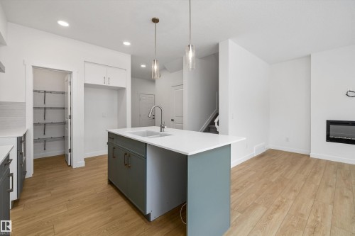 915 19 Avenue, Edmonton, AB - Indoor Photo Showing Kitchen With Fireplace With Upgraded Kitchen