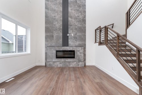 43 Maple Crescent, Gibbons, AB - Indoor Photo Showing Living Room With Fireplace