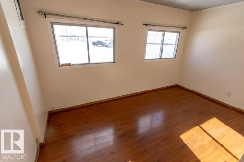 Room featuring light-colored walls and wood-look flooring - 112, 57004 Range Rd 105, Rural St. Paul County, AB - Indoor Photo Showing Other Room