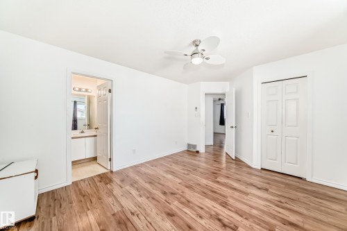 This room features hardwood flooring, white walls, and a ceiling fan - 1832 42 Street, Edmonton, AB - Indoor Photo Showing Other Room