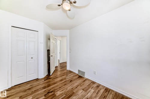 This room features wood plank flooring and a ceiling fan - 1832 42 Street, Edmonton, AB - Indoor Photo Showing Other Room