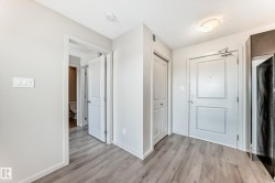 The property features light-toned flooring, white walls, and white doors, creating a bright and airy atmosphere - 
