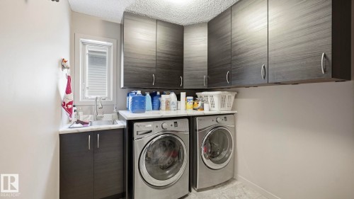 1027 Coopers Hawk Link Link, Edmonton, AB - Indoor Photo Showing Laundry Room