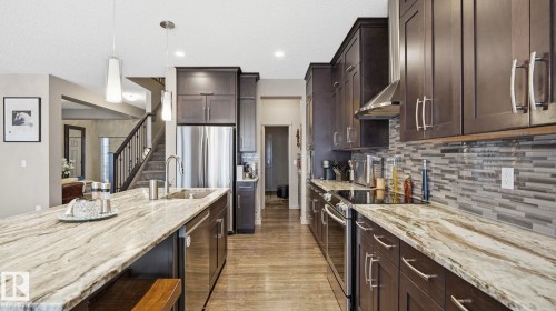 1027 Coopers Hawk Link Link, Edmonton, AB - Indoor Photo Showing Kitchen With Upgraded Kitchen