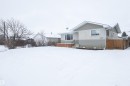 The property features a neutral-toned exterior with stucco and siding finishes - 4420 56 Avenue, Barrhead, AB  - Outdoor 