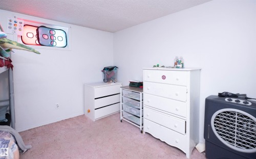 This room features white walls and a window - 4420 56 Avenue, Barrhead, AB - Indoor Photo Showing Bedroom