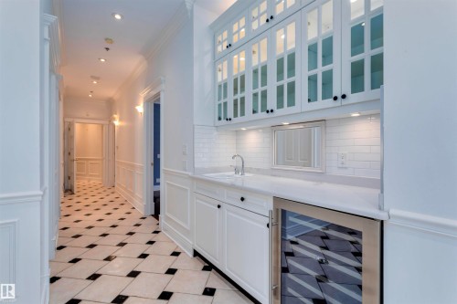 The property features a hallway with black and white checkered floor tiling - 102 11826 100, Edmonton, AB - Indoor Photo Showing Other Room