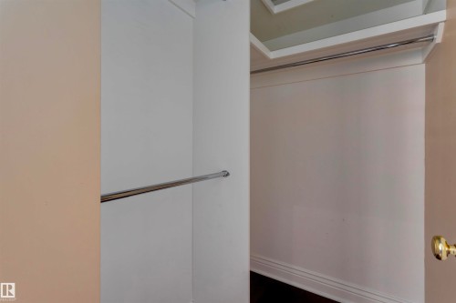This property features a closet with a hanging rod - 102 11826 100, Edmonton, AB - Indoor Photo Showing Other Room