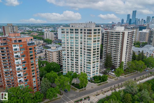 This property offers a high-rise living experience with views of the surrounding urban landscape and distant city skyline - 102 11826 100, Edmonton, AB - Outdoor With Facade