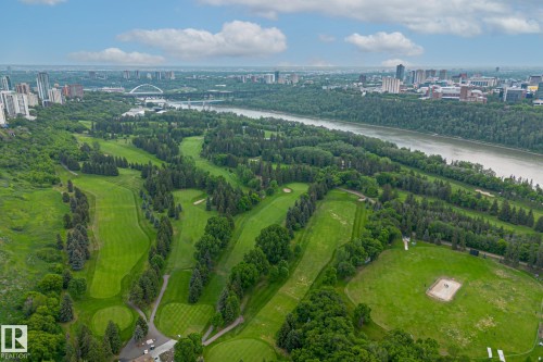 Aerial view showcasing expansive green golf fairways surrounded by mature trees - 102 11826 100, Edmonton, AB - Outdoor With View