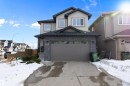 The property features a two-story exterior with a contrasting facade, an attached garage, and a concrete driveway - 6303 169 Avenue, Edmonton, AB  - Outdoor 