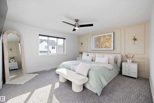 This room features light-colored walls and patterned carpeting - 6303 169 Avenue, Edmonton, AB - Indoor Photo Showing Bedroom