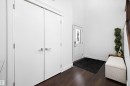 Entryway featuring dark hardwood flooring, a white front door with decorative glass inserts, and a high ceiling - 6303 169 Avenue, Edmonton, AB  - Indoor Photo Showing Other Room 