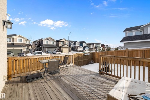 The property features a spacious wooden deck with a wooden railing, providing an outdoor area - 6303 169 Avenue, Edmonton, AB - Outdoor With Deck Patio Veranda With Exterior