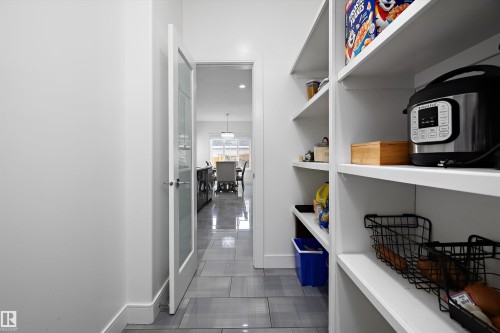 Spacious pantry featuring extensive shelving for storage - 6303 169 Avenue, Edmonton, AB - Indoor