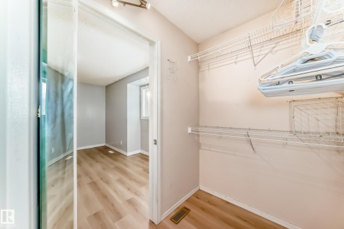 Walk in closet with light wood-style flooring - 11609 125 Street, Edmonton, AB - Indoor