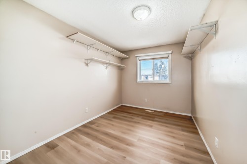 Walk in closet featuring light wood-type flooring - 11609 125 Street, Edmonton, AB - Indoor Photo Showing Other Room