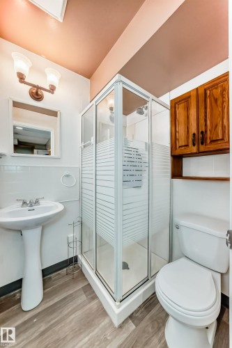 Full bathroom with light wood finished floors and a shower stall - 11609 125 Street, Edmonton, AB - Indoor Photo Showing Bathroom