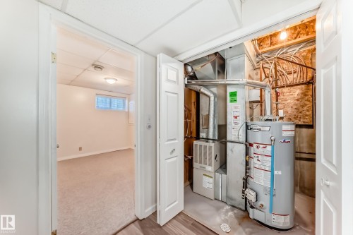 Utility room with water heater and heating unit - 11609 125 Street, Edmonton, AB - Indoor