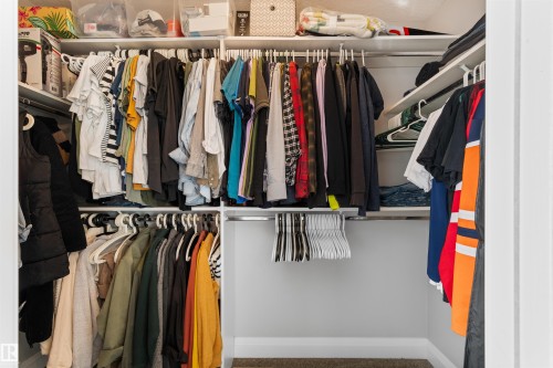 The property features a spacious closet with built-in shelving, providing ample storage solutions - 4917 Charles Point(E), Edmonton, AB - Indoor With Storage