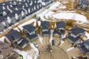 This aerial view highlights the property's cul-de-sac location with a driveway and garage - 4917 Charles Point(E), Edmonton, AB  - Outdoor With View 