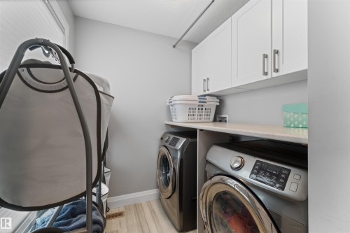upstairs laundry room - 4917 Charles Point(E), Edmonton, AB - Indoor Photo Showing Laundry Room