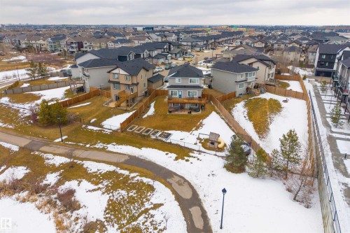 The property features a fenced yard with a deck and includes a detached garage - 4917 Charles Point(E), Edmonton, AB - Outdoor With View