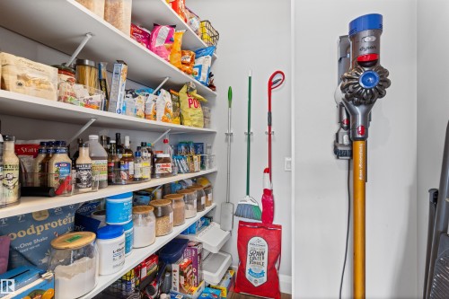 Pantry featuring extensive shelving for storage - 4917 Charles Point(E), Edmonton, AB - Indoor With Storage