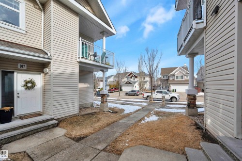This property features a private entrance with a white door and an exterior balcony - 106 3040 Spence Wynd, Edmonton, AB - Outdoor With Balcony