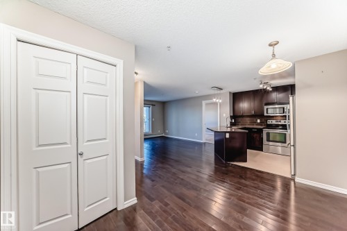 This property features rich hardwood flooring throughout the main living areas - 208 2204 44 Ave, Edmonton, AB - Indoor Photo Showing Kitchen