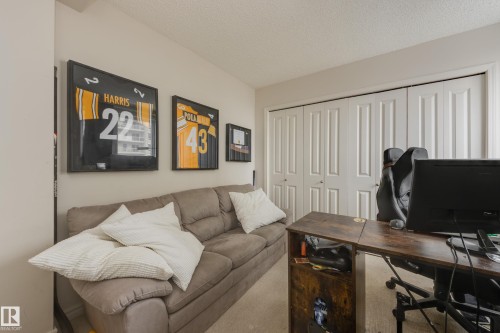 This room features light-colored walls and carpeted flooring, providing a neutral backdrop - 1007 10180 104 Street, Edmonton, AB - Indoor