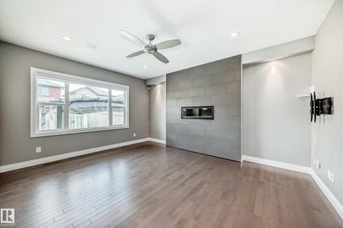 1921 33 Street, Edmonton, AB - Indoor Photo Showing Other Room With Fireplace