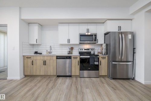 101 860 Secord Blvd, Edmonton, AB - Indoor Photo Showing Kitchen With Stainless Steel Kitchen With Upgraded Kitchen