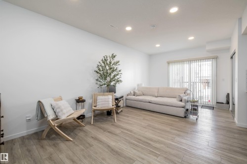 Bachelor Suite section! - 101 860 Secord Blvd, Edmonton, AB - Indoor Photo Showing Living Room