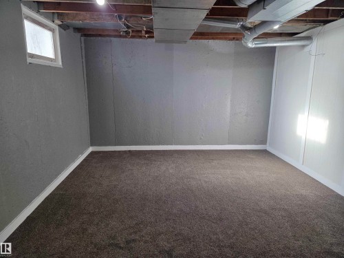 Below grade area featuring carpet floors and baseboards - 13023 Sherbrooke Avenue, Edmonton, AB - Indoor Photo Showing Basement