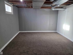 Below grade area featuring carpet floors and baseboards - 