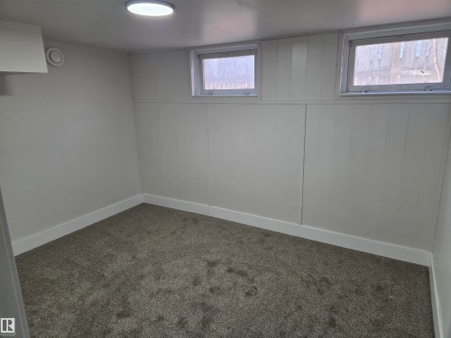 Basement featuring carpet and baseboards - 13023 Sherbrooke Avenue, Edmonton, AB - Indoor Photo Showing Other Room