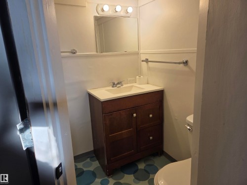 Bathroom featuring dark flooring and vanity - 13023 Sherbrooke Avenue, Edmonton, AB - Indoor Photo Showing Bathroom