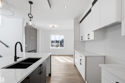 24 Meadowgrove Landing, Spruce Grove, AB - Indoor Photo Showing Kitchen With Double Sink