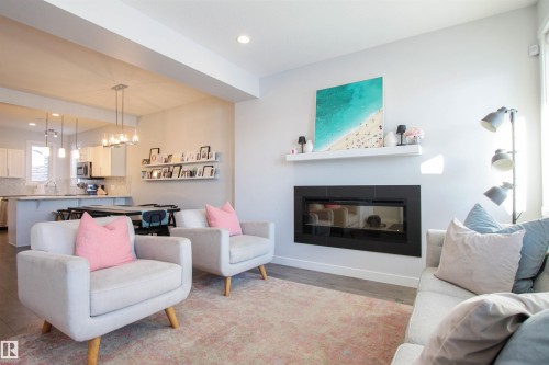 16752 15 Avenue, Edmonton, AB - Indoor Photo Showing Living Room With Fireplace