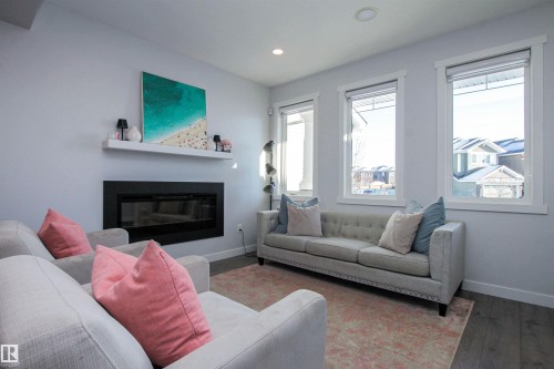 16752 15 Avenue, Edmonton, AB - Indoor Photo Showing Living Room With Fireplace