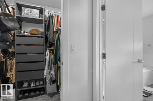 The property features a well-organized closet with shelving and drawer storage - 16624 32 Avenue, Edmonton, AB - Indoor