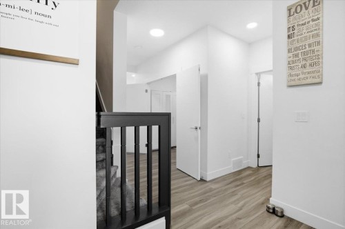 Entryway featuring light wood-style flooring, white walls, and recessed lighting - 16624 32 Avenue, Edmonton, AB - Indoor Photo Showing Other Room